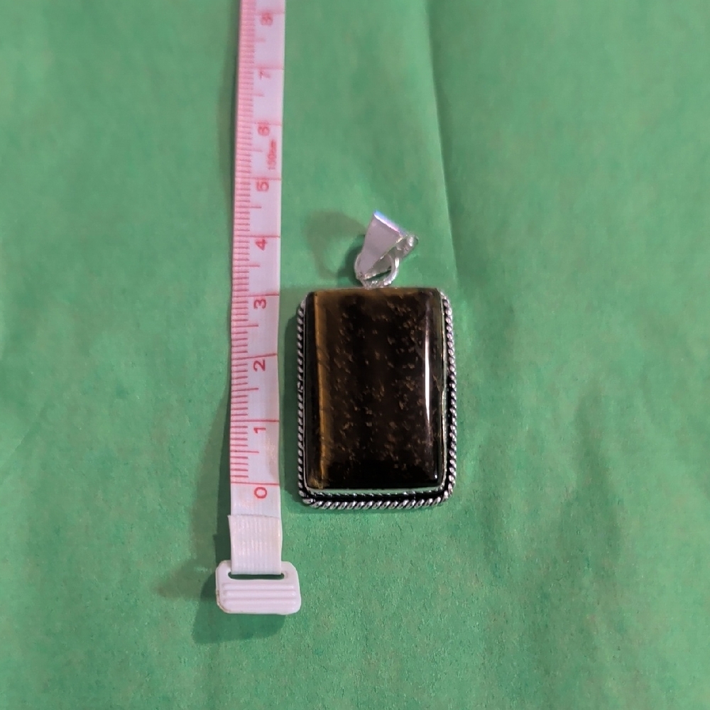 Rectangular Brown Pendant With Silver Frame - image 1